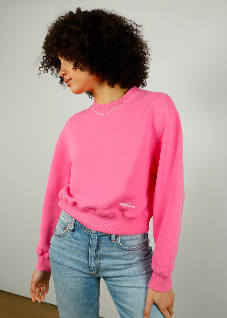 Champion uo exclusive logo script pink crew neck hot sale sweatshirt